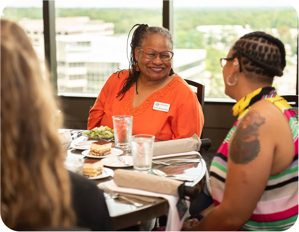 nawbo memphis members at table eating and talking