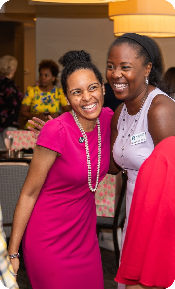 two women members of Nawbo Memphis smile and pose for camera